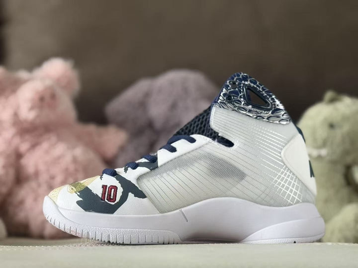 Side view of a white Nike Kobe basketball shoe with navy and gold details.