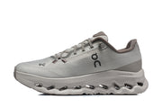 Side profile of a gray On Cloudmonster 3 running shoe