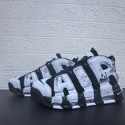 Pair of black and white sneakers shown from the side with oversized AIR lettering.
