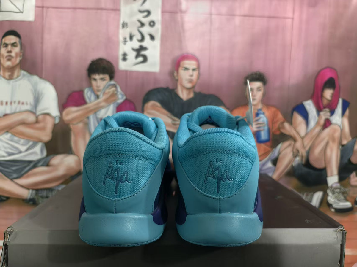 Rear view of blue Nike basketball sneakers showing padded collars, blue heel panels, and embossed heel branding.