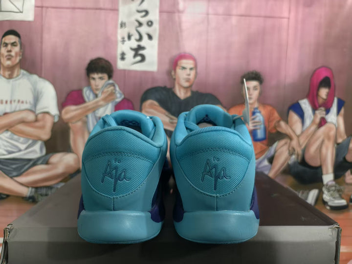 Rear view of blue Nike basketball sneakers showing padded collars, blue heel panels, and embossed heel branding.