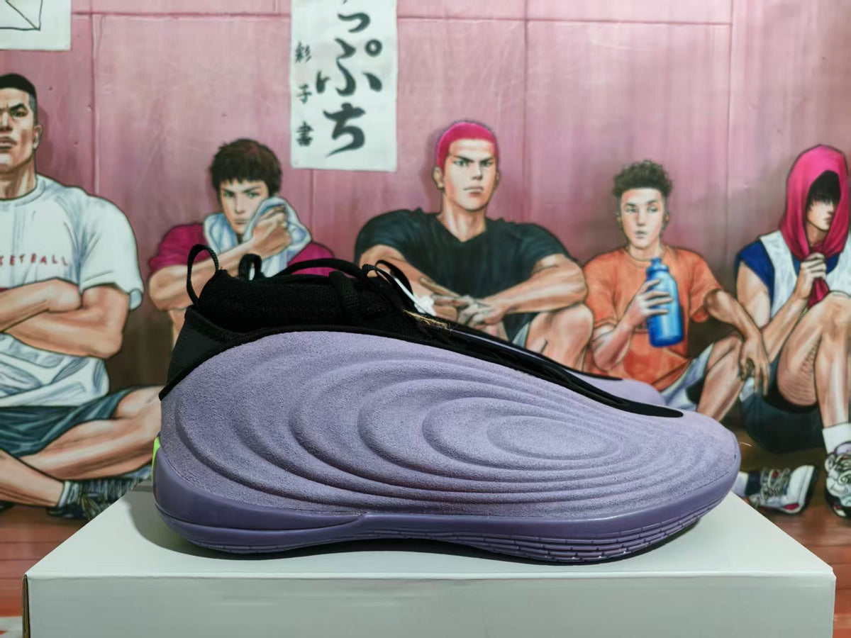 Side view of a purple Nike basketball shoe with black collar details and a sculpted upper