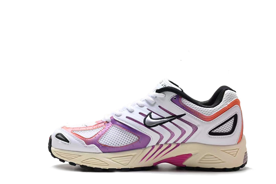 Side view of a white Nike retro running sneaker with purple and orange accents, black Swoosh, mesh panels, and cream-colored sole.