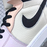 Close-up of the textured light-colored side panel, black Swoosh, pastel overlay, and black laces.