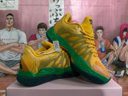 Angled view of yellow and green basketball sneakers