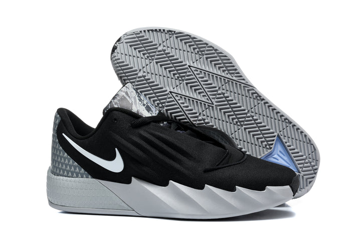 Nike Ja basketball shoe in black, grey and white, shown with the patterned outsole visible.