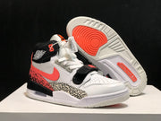 Three-quarter view with one shoe lifted to show the white and coral outsole pattern alongside the upper shoe.