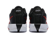 Rear view of the black basketball shoes showing padded collars, perforated heel panels, white midsoles, and red outsole accents.