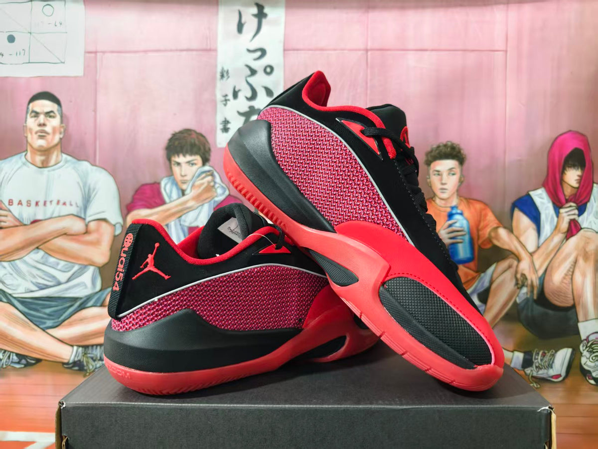 Pair of black and red Jordan Luka basketball shoes shown from the side and top.