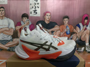 Side view of white ASICS sneakers showing the black-and-orange ASICS side logo and sculpted sole.