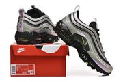 Nike Air Max 97 sneakers in silver, black, and green, displayed with a box; the box label shows a sample size of 7.