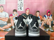 Rear view showing the black heel panels and Jumpman logos on the sneakers.