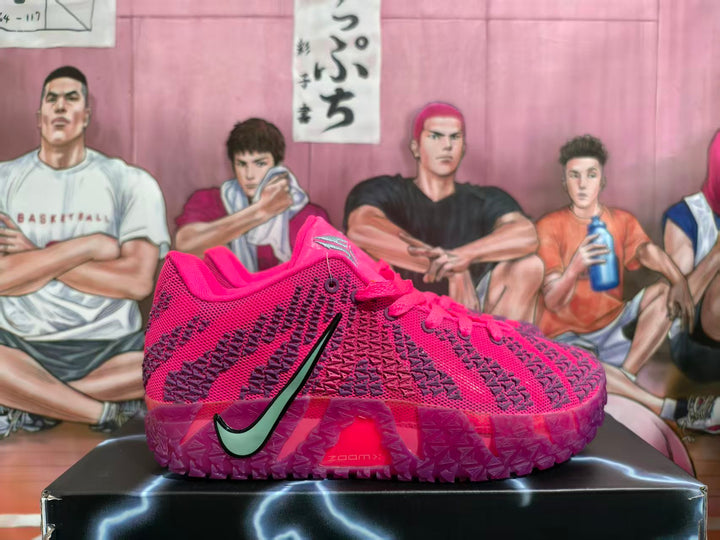 Pink Nike Sabrina 2 basketball shoe with purple patterned details and pale green side Swoosh