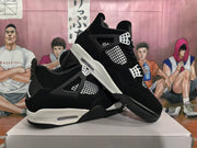 Pair of black and white high-top sneakers displayed at an angle, showing the side panels, lace supports, and contrasting midsoles.