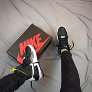 Overhead lifestyle view showing the sneakers beside a Nike shoebox.