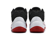 Rear view showing the black and white layered heel design with red outsole sections