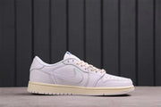 Side profile of a white low-top sneaker with a tonal Swoosh and cream-colored outsole.