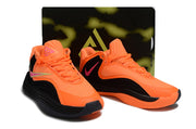 Orange and black Nike Giannis Immortality 7 shoes with a patterned display box