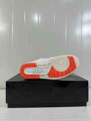 Outsole view showing a white and orange tread pattern with a visible Nike wordmark.