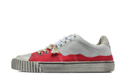Side profile of a red and gray low-top sneaker