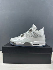 Clean side profile of a grey Jordan Air Jordan 4 sneaker with mesh side panel, padded collar and visible midsole air unit.
