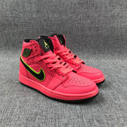 Front three-quarter view of the pair with black tongues and hot pink laces.