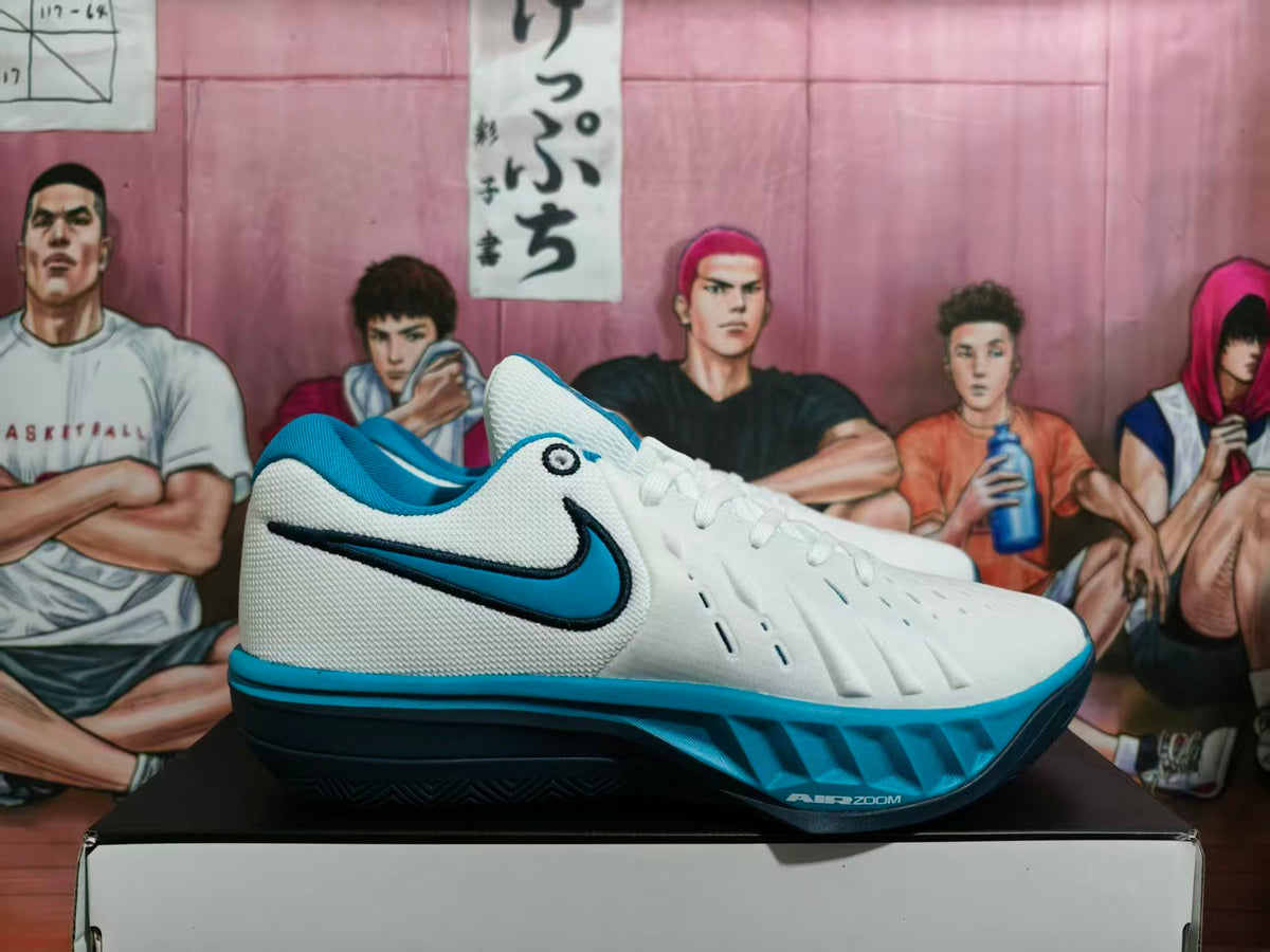 Side view of white Nike LeBron basketball shoes with black and blue accents