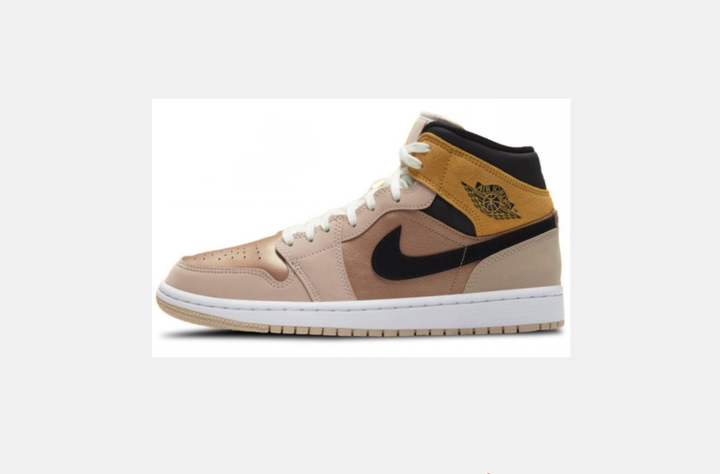 Side view of tan and beige high-top sneakers with black collar and side detail, white laces, white midsole, tan outsole, and a winged basketball emblem.