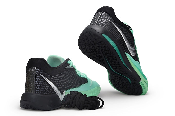 Nike Sabrina 4 shoes shown from the heel and outsole, in black and mint green.