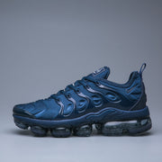 Side profile of a blue Nike Air VaporMax Plus TN-15 sneaker.