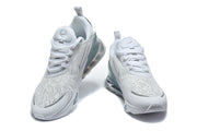 Front view of a pair of white Nike Air Max 270 Premium sneakers with teal-toned heel details.