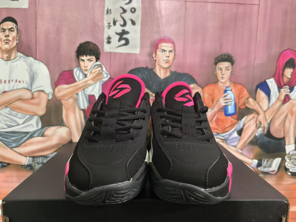 Pair of black and pink low-top basketball sneakers shown from the front
