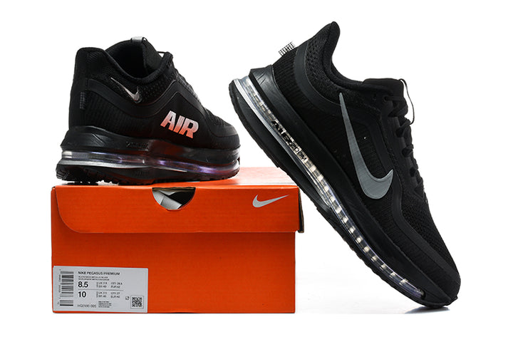 Black Nike Air Zoom Pegasus Premium shoes beside an orange Nike shoe box; the box label shows sample size 8.5 US men and 10 US women.