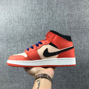 Side profile showing the black Swoosh, cream mid-panel, orange-pink overlays and white midsole.