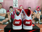 Rear view of the pair showing red heel panels and Nike branding.