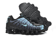 Nike Shox TL sneaker showing the patterned outsole and side profile.