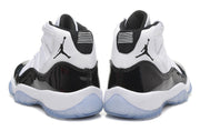 Rear view of the pair showing black heel panels, white midsoles, and translucent outsole sections.