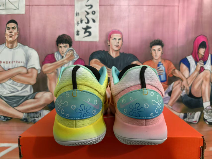 Rear view of the mismatched yellow and pink Nike basketball sneakers, showing teal heel panels.