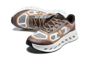 Pair of brown and gray On Cloudtilt Remix sneakers viewed from above and the front