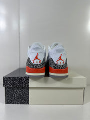 Rear view showing red Jordan logos, grey elephant-print heel overlays, and red midsole accents.