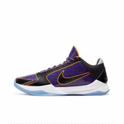 Purple and black Nike Kobe 5-style basketball shoe with gold trim and a translucent outsole.