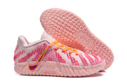 Side and outsole view showing the purple-and-gold Nike Swoosh, pink textured sole, and ZoomX marking.