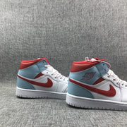 Pair of Jordan mid-top sneakers displayed from the outer side.