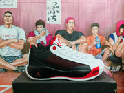 Side profile showing the white forefoot, black heel and midsole area, red accents, and printed AIR ZOOM lettering.