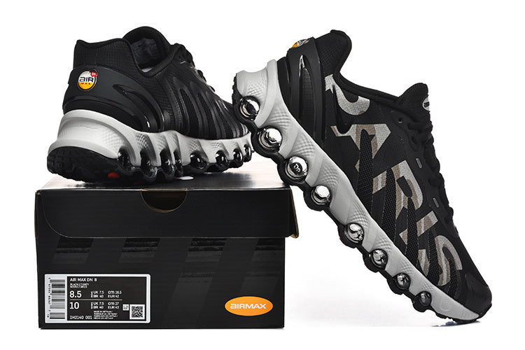 Nike Air Max DN 8 Paris sneakers shown from the side with the shoe box; the box label displays sample sizes 8.5 and 10.