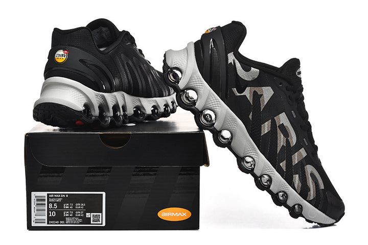 Nike Air Max DN 8 Paris sneakers shown from the side with the shoe box; the box label displays sample sizes 8.5 and 10.