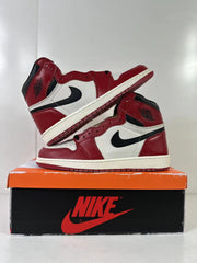 Two high-top sneakers arranged to show the side panels, ankle logos, and red outsole.