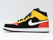 Side profile showing the high-top shape, white side branding, yellow ankle overlay, and red-orange heel panel