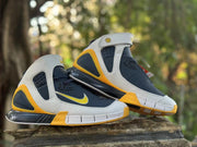 Pair of Nike Kobe 2K5 high-tops in navy, white, and yellow