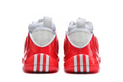 Rear view of the white and red sneakers showing heel details and pull tabs.